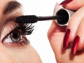 Close up of woman applying makeup mascara